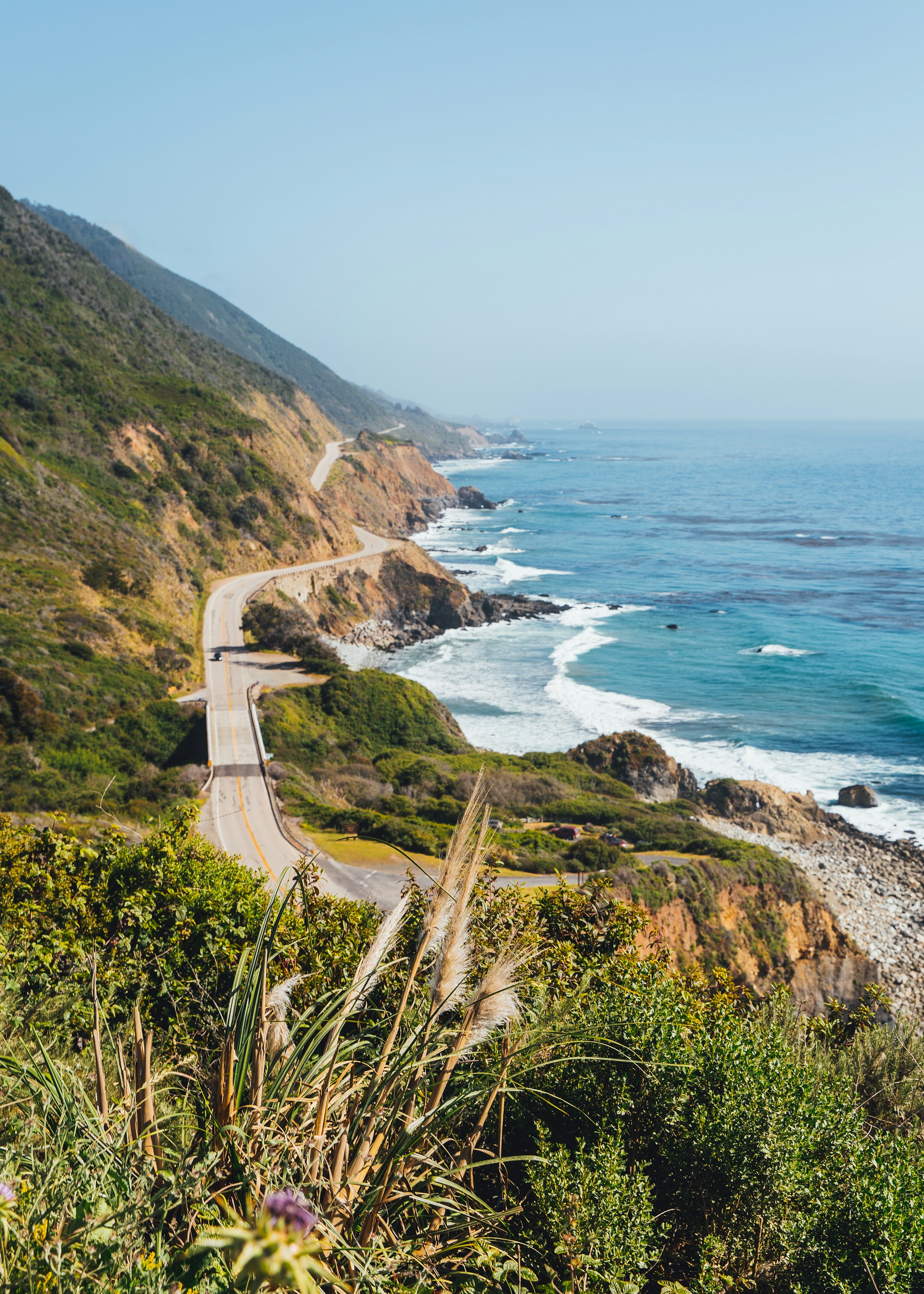 A winding coastal road beside the ocean